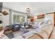 Inviting living room featuring a large window with scenic outdoor views and comfortable seating at 5384 Olde Stage Rd, Boulder, CO 80302