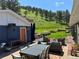 Inviting outdoor patio featuring comfortable seating and a dining table, perfect for enjoying the natural landscape at 5384 Olde Stage Rd, Boulder, CO 80302