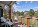 Relaxing porch with white Adirondack chairs and scenic mountain views in the background at 5384 Olde Stage Rd, Boulder, CO 80302