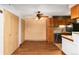 This dining room features wood-look flooring, closet storage, and a ceiling fan at 7040 W 20Th Ave # 206, Lakewood, CO 80214