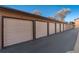 Garages with beige doors and dark trim for tenant parking at 7040 W 20Th Ave # 206, Lakewood, CO 80214