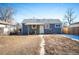 Backyard with patio, shed, and wooden fence at 1665 Lima St, Aurora, CO 80010