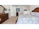 Comfortable bedroom with a queen bed, side tables, and natural light at 15802 Xanthia Way, Thornton, CO 80602