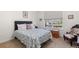 Comfortable bedroom with a floral-patterned bed, soft lighting, and a cozy atmosphere for restful nights at 15802 Xanthia Way, Thornton, CO 80602