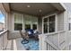 Outdoor deck with seating area and sliding door access to the dining room at 15802 Xanthia Way, Thornton, CO 80602