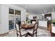 Dining room featuring hardwood floors, neutral decor and sliding doors to an outside deck at 15802 Xanthia Way, Thornton, CO 80602