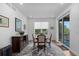 Dining room featuring hardwood floors, neutral decor and a large window at 15802 Xanthia Way, Thornton, CO 80602