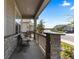 Comfortable covered porch with stone pillars, seating, and neighborhood views at 15802 Xanthia Way, Thornton, CO 80602