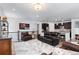 Spacious living room featuring hardwood floors and lots of light and stylish, modern decor at 15802 Xanthia Way, Thornton, CO 80602