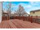 Spacious, stained wooden deck with decorative wooden railings offers great views of the backyard at 18948 E Baker Pl, Aurora, CO 80013