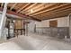Unfinished basement with concrete floor, exposed ceiling, and stud wall framing at 18948 E Baker Pl, Aurora, CO 80013
