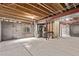 Unfinished basement with concrete floor, exposed ceiling, and stud wall framing at 18948 E Baker Pl, Aurora, CO 80013