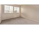 Neutral bedroom with two windows and carpeted floor at 18948 E Baker Pl, Aurora, CO 80013