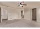 A carpeted bedroom has a ceiling fan and multiple closets at 18948 E Baker Pl, Aurora, CO 80013