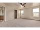 A comfortable bedroom has a ceiling fan and includes an ensuite bathroom at 18948 E Baker Pl, Aurora, CO 80013