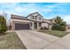 Attractive two-story home with a well-kept front lawn and a cozy front porch area at 18948 E Baker Pl, Aurora, CO 80013