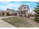 Two-story home with a two car garage, front porch, and good proximity to nearby homes at 18948 E Baker Pl, Aurora, CO 80013