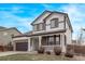 This home boasts great curb appeal, stone accents, and a covered front porch area at 18948 E Baker Pl, Aurora, CO 80013