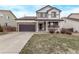 Beautiful two-story home with a front-facing two car garage and a welcoming front porch at 18948 E Baker Pl, Aurora, CO 80013