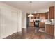 A kitchen with wood cabinets and black appliances offers a practical cooking space at 18948 E Baker Pl, Aurora, CO 80013
