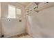 Laundry room with upper shelves and a window at 18948 E Baker Pl, Aurora, CO 80013