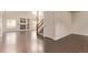 Open-concept living room featuring a fireplace, hardwood floors, and abundant natural light at 18948 E Baker Pl, Aurora, CO 80013