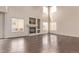 Bright and open living room featuring a fireplace, high ceilings, and hardwood floors at 18948 E Baker Pl, Aurora, CO 80013