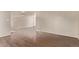 Spacious living area featuring hardwood flooring, neutral walls, and a closet at 18948 E Baker Pl, Aurora, CO 80013