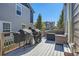 Outdoor back deck area featuring modern patio furniture and grilling station for outdoor dining at 3075 Distant Rock Ave, Castle Rock, CO 80109