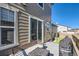 Cozy back deck featuring modern patio furniture and grilling station with sliding glass door access at 3075 Distant Rock Ave, Castle Rock, CO 80109