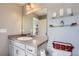 Well-lit bathroom with a large mirror, neutral walls, and ample vanity space at 3075 Distant Rock Ave, Castle Rock, CO 80109