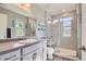 Modern bathroom features a glass enclosed shower and stylish vanity with lots of light at 3075 Distant Rock Ave, Castle Rock, CO 80109
