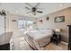 Bright main bedroom featuring natural lighting, ceiling fan and soft carpet at 3075 Distant Rock Ave, Castle Rock, CO 80109