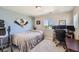 Bedroom has plush carpet, light blue accent wall, standard closet, ceiling fan, and window views of the neighborhood at 3075 Distant Rock Ave, Castle Rock, CO 80109