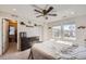 Bright bedroom featuring neutral walls, carpet, and a ceiling fan for added comfort at 3075 Distant Rock Ave, Castle Rock, CO 80109