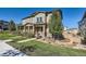 Charming two-story townhome boasts a landscaped yard and inviting front porch at 3075 Distant Rock Ave, Castle Rock, CO 80109