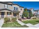 Attractive townhome featuring a cozy front porch and professionally landscaped front yard at 3075 Distant Rock Ave, Castle Rock, CO 80109