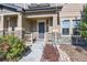Inviting covered porch features stone accents, and a cozy seating area at 3075 Distant Rock Ave, Castle Rock, CO 80109