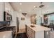 Well-lit kitchen with stainless steel appliances, a kitchen island and stylish backsplash at 3075 Distant Rock Ave, Castle Rock, CO 80109