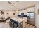 Modern kitchen with stainless steel appliances, stylish island with barstool seating at 3075 Distant Rock Ave, Castle Rock, CO 80109