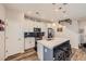 Bright kitchen with stainless steel appliances, a large island, and modern accents at 3075 Distant Rock Ave, Castle Rock, CO 80109