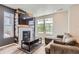 Comfortable living room featuring a fireplace and a large sectional sofa at 3075 Distant Rock Ave, Castle Rock, CO 80109