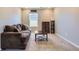 Cozy living room with a comfortable sofa, coffee table, and modern decor at 3075 Distant Rock Ave, Castle Rock, CO 80109