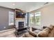 Stylish living room with modern fireplace, a sleek coffee table, and a comfortable sectional at 3075 Distant Rock Ave, Castle Rock, CO 80109