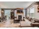 Inviting living room with cozy fireplace, modern furniture, and sliding glass door at 3075 Distant Rock Ave, Castle Rock, CO 80109