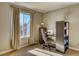 Neutral bedroom with sewing station, window, carpeted floor and natural light at 6462 Freeport Dr, Highlands Ranch, CO 80130