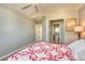 Bedroom showing a glimpse of the en-suite bathroom and walk-in closet at 6462 Freeport Dr, Highlands Ranch, CO 80130