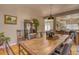 Cozy dining area with warm wood accents, seamlessly connected to the kitchen and living spaces at 6462 Freeport Dr, Highlands Ranch, CO 80130