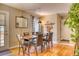 Inviting dining room with wood floors, stylish seating, and natural light, creating a cozy ambiance at 6462 Freeport Dr, Highlands Ranch, CO 80130