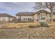 Backyard view of patio with furniture, sliding glass door, grass yard and view of expansive field at 16399 Somerset Dr, Broomfield, CO 80023